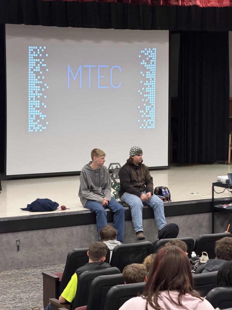 2 MTEC students sitting on the stage