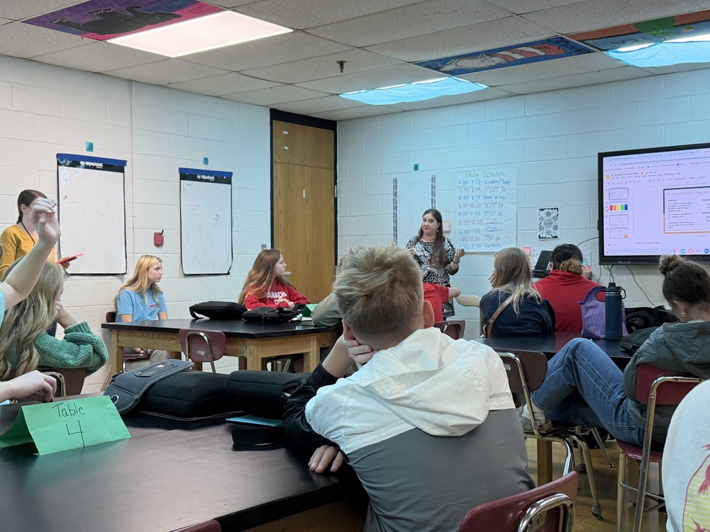 Banker talking to class of students