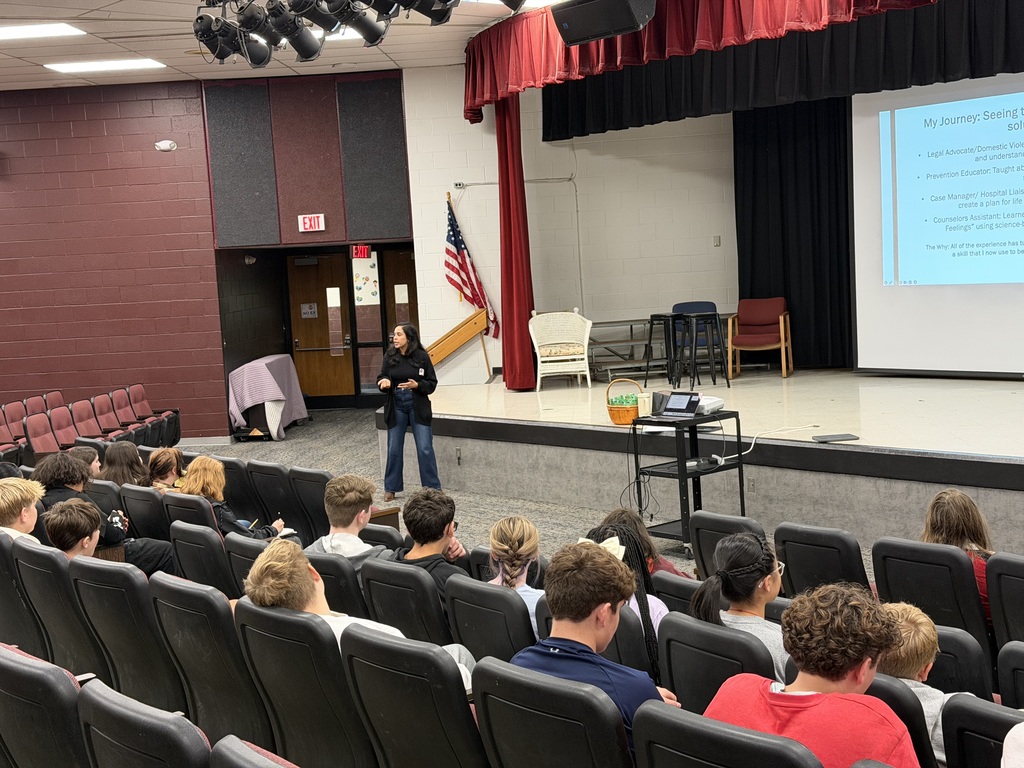 Speaker talking to a group of students