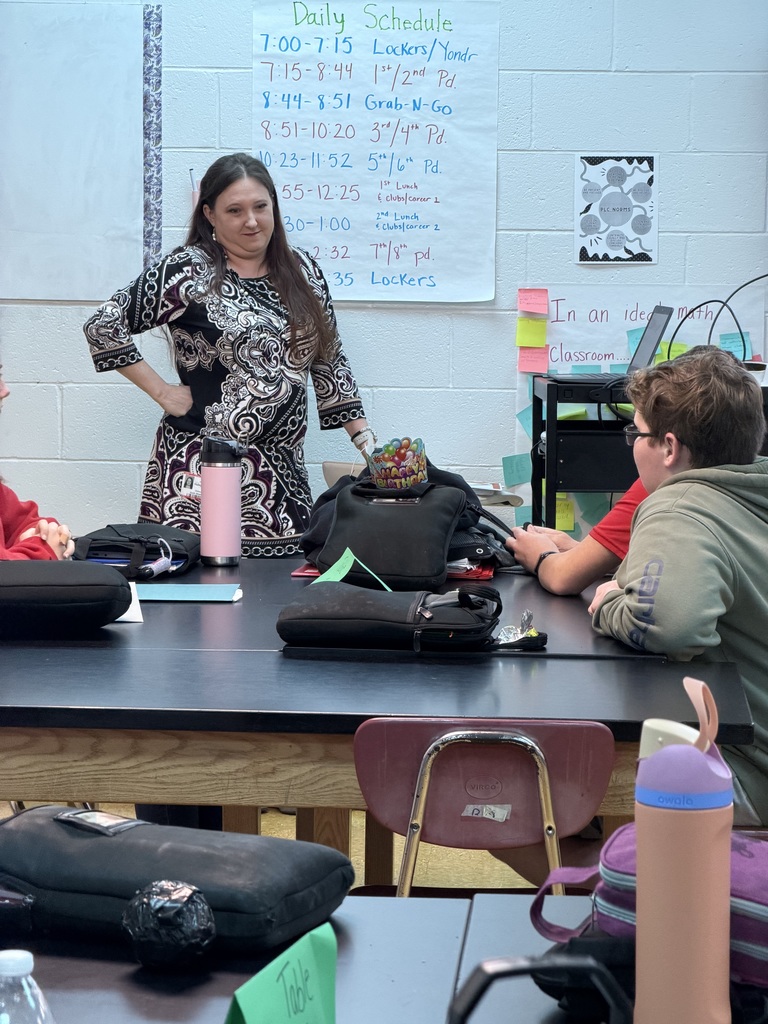 Banker talking to a class of students