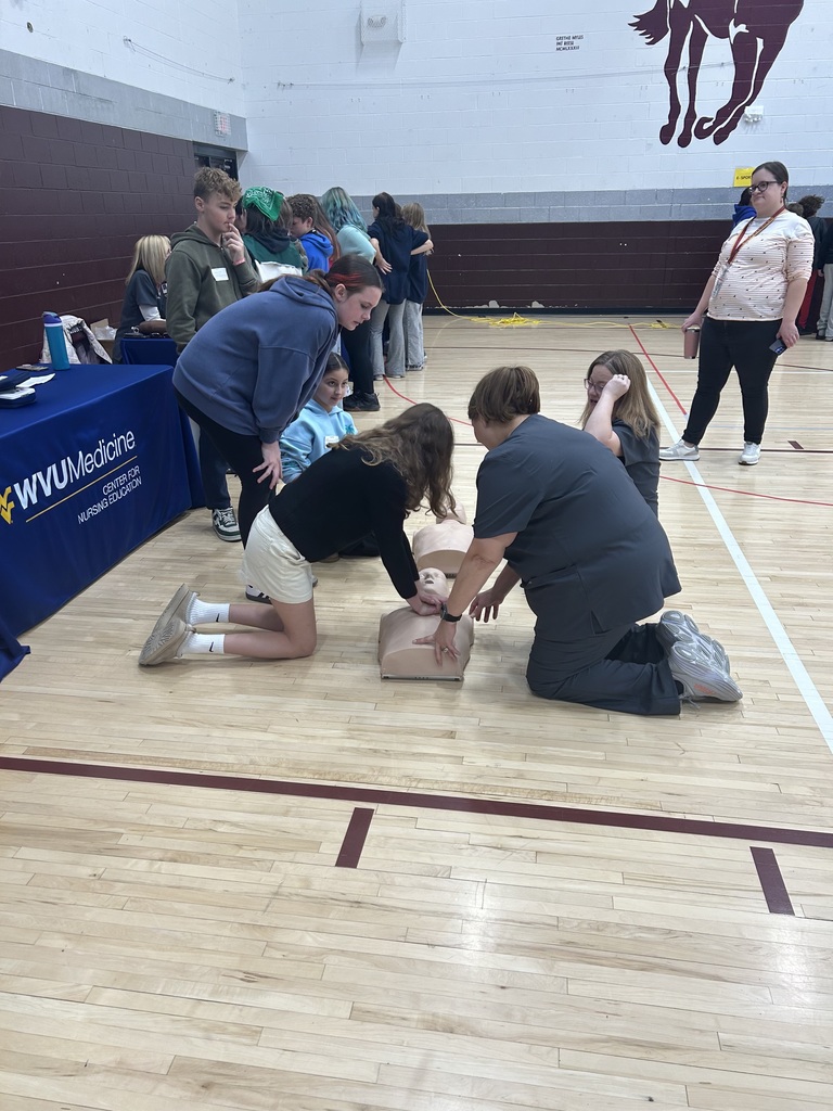 student being shown how to give CPR