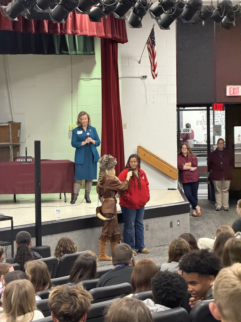 lady mountaineer asking a student questions