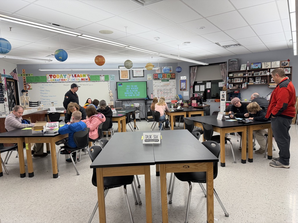 Classroom with people completing an escape room activity