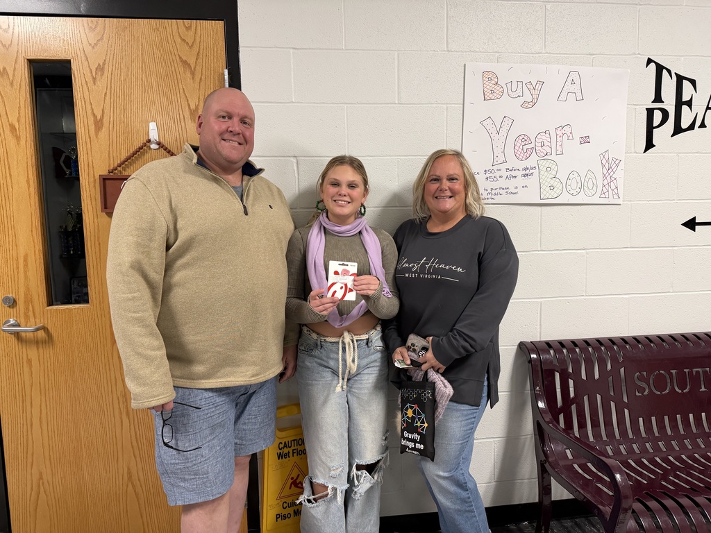Family holding a Gift card