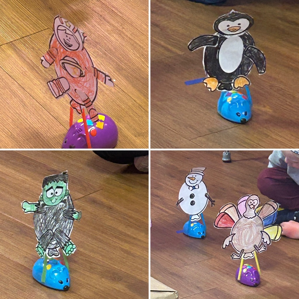 four coding mice with characters attached to them