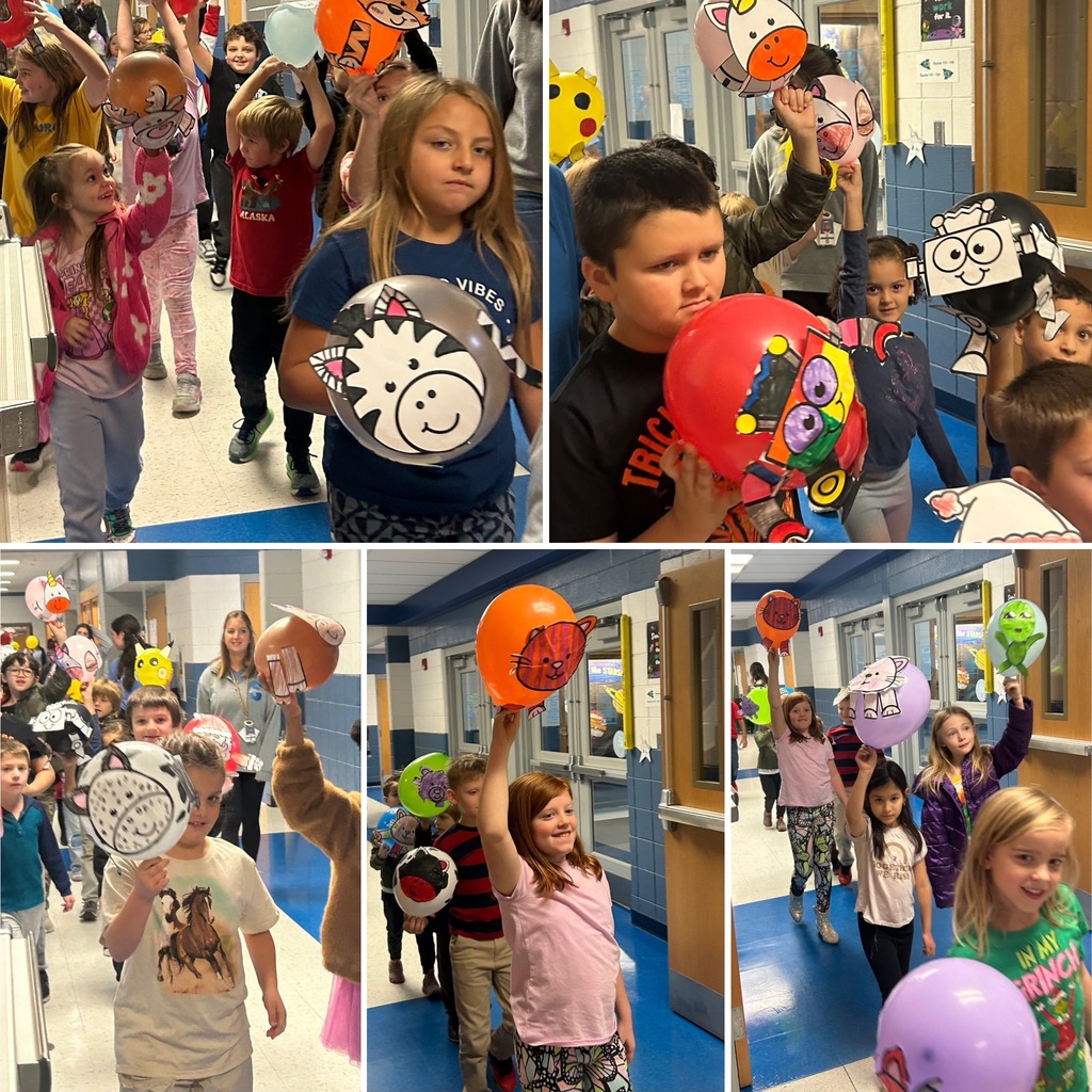 students walking in hallway displaying their balloons in a parade