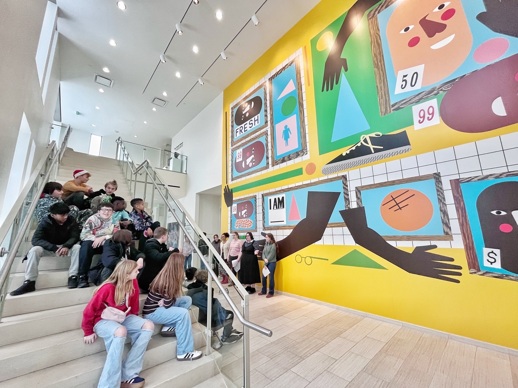 Art Museum and students sitting on stairs