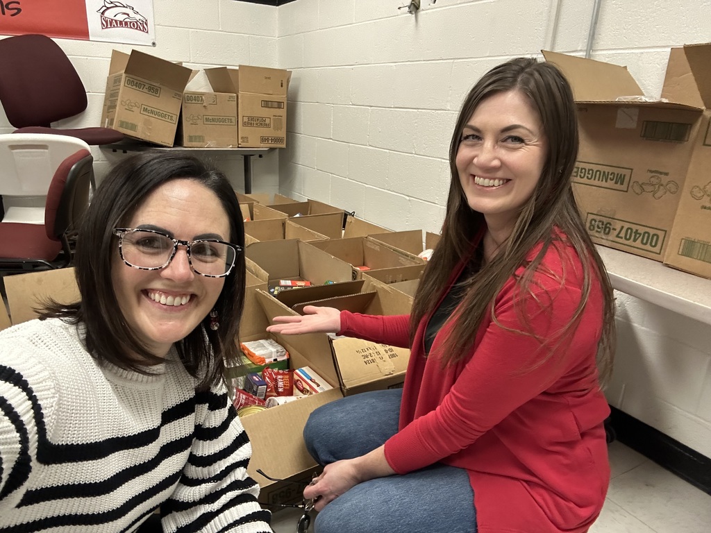 2 staff members filling boxes