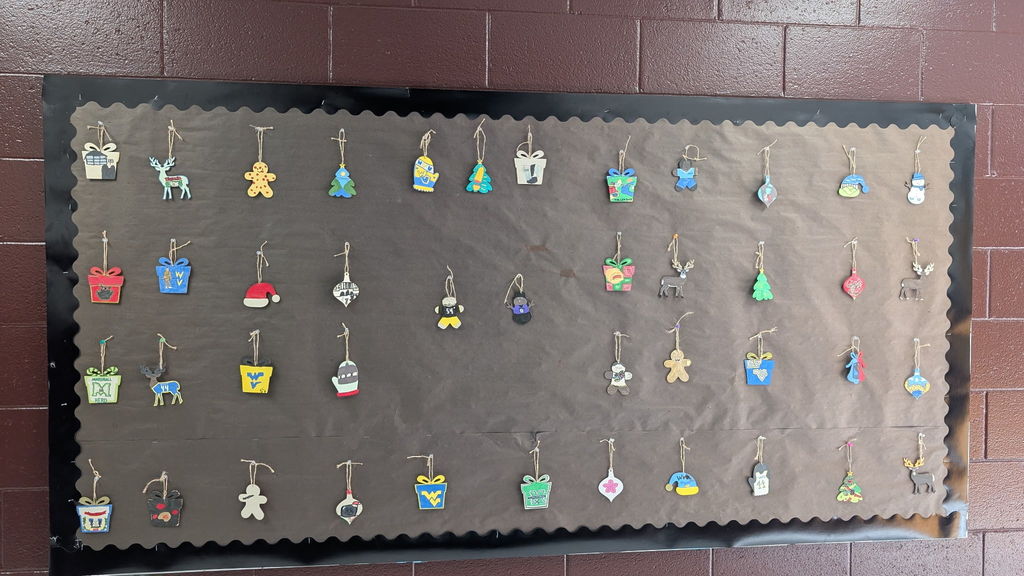ornaments hanging on a bulletin board
