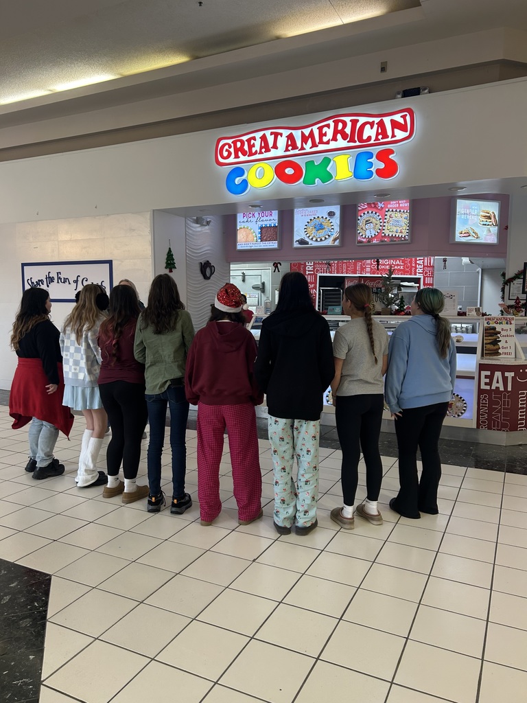 Choir singing at the Great American Cookie Company