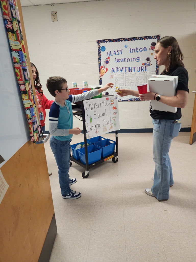 Miss King's Social Skills class working to provide the staff with tasty treats by running the snack cart!