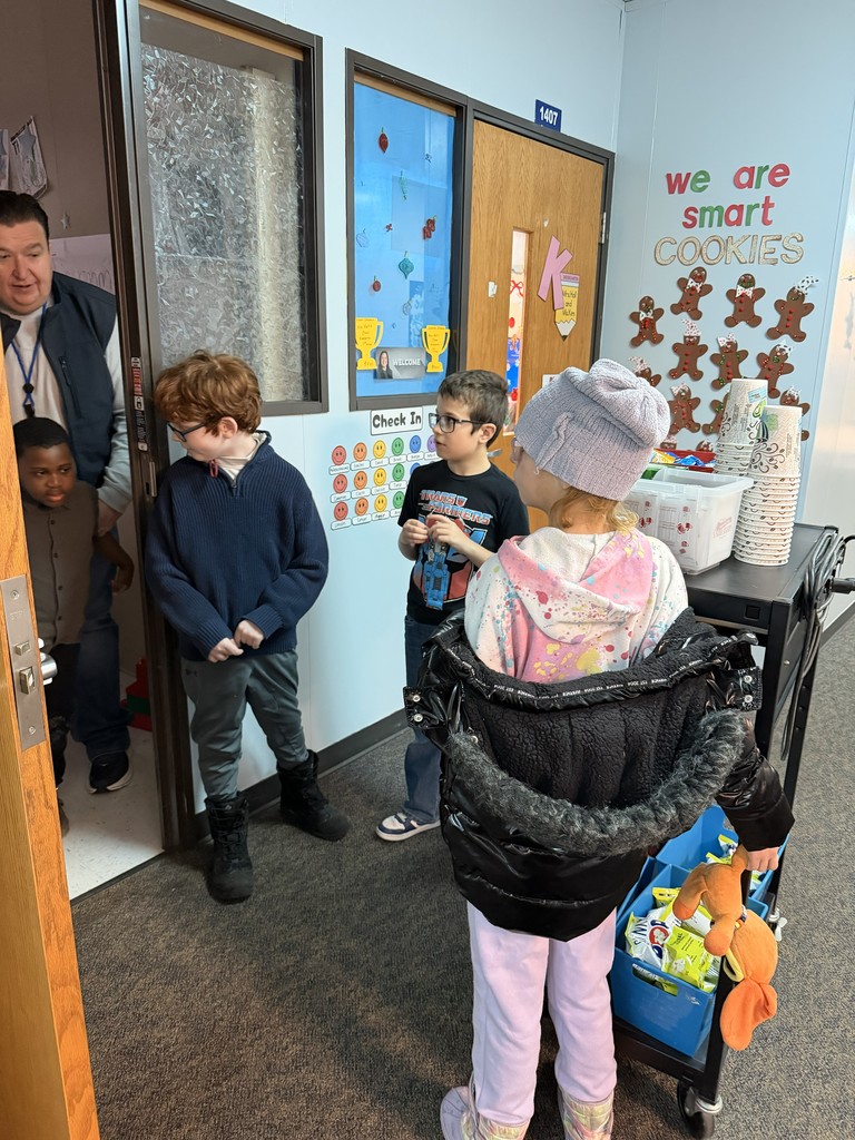 Miss King's Social Skills class working to provide the staff with tasty treats by running the snack cart!