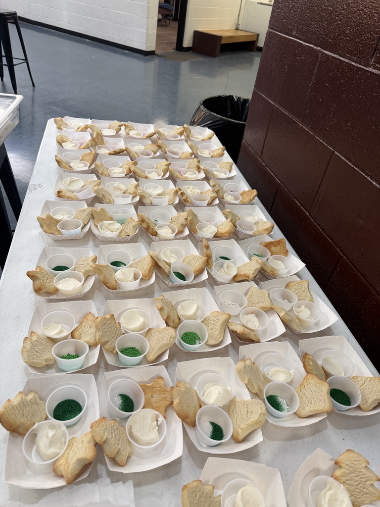 cookies ready to be decorated sitting on a table