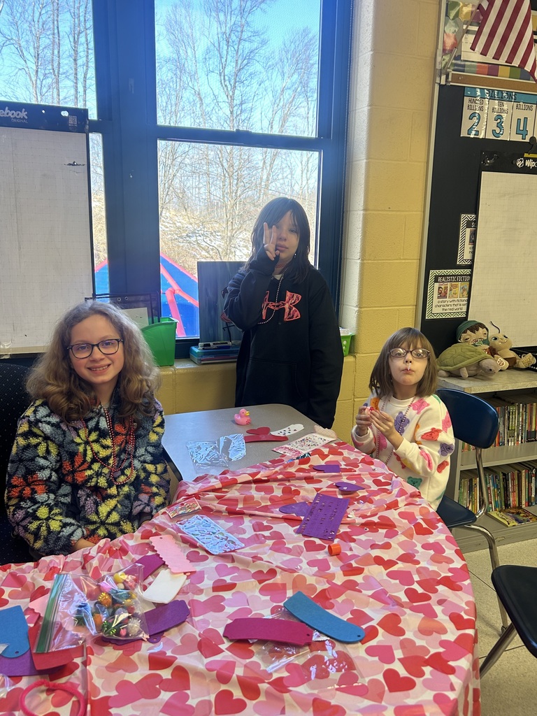 girls with a peace sign and doing crafts