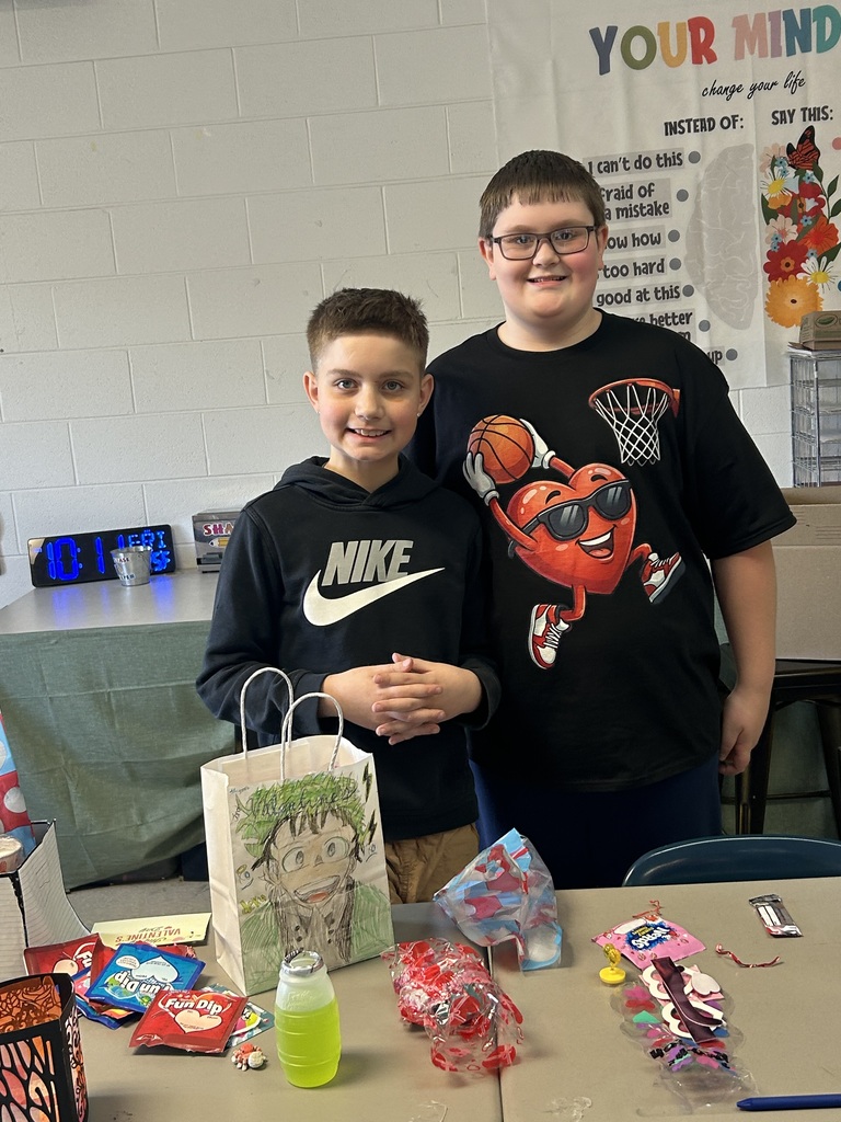 Valentine bag full of candy and two friends smiling for the camera