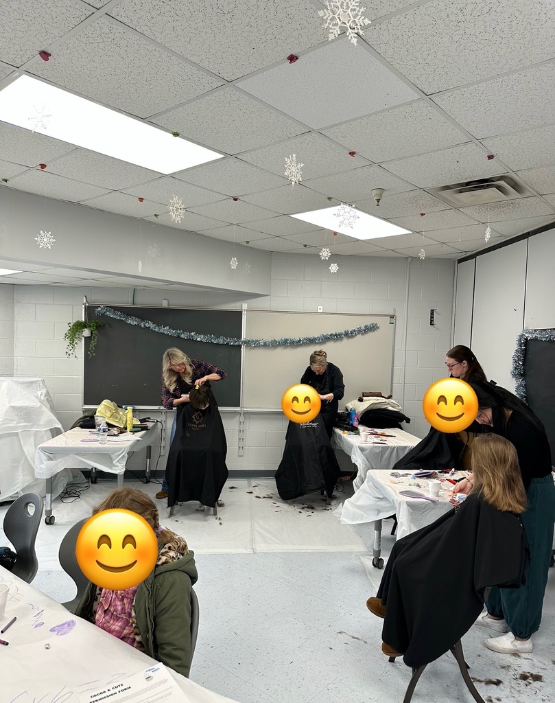 Pictures show students getting haircuts at school.