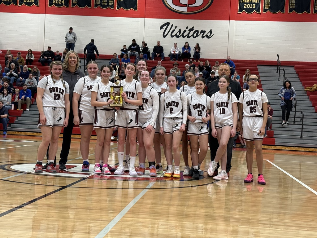 Varsity Girls holding a trophy