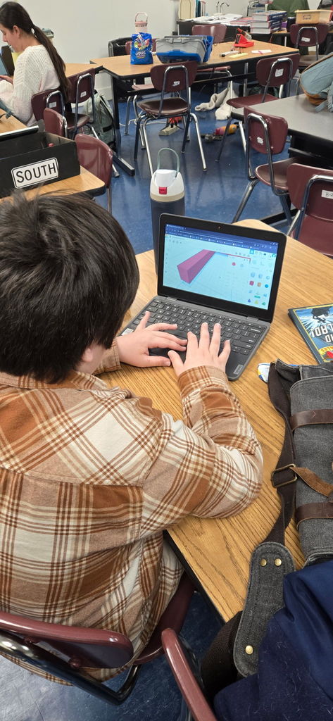 Boy typing on a computer