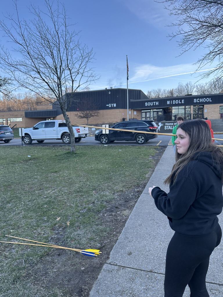 Girl getting ready to throw an arrow 