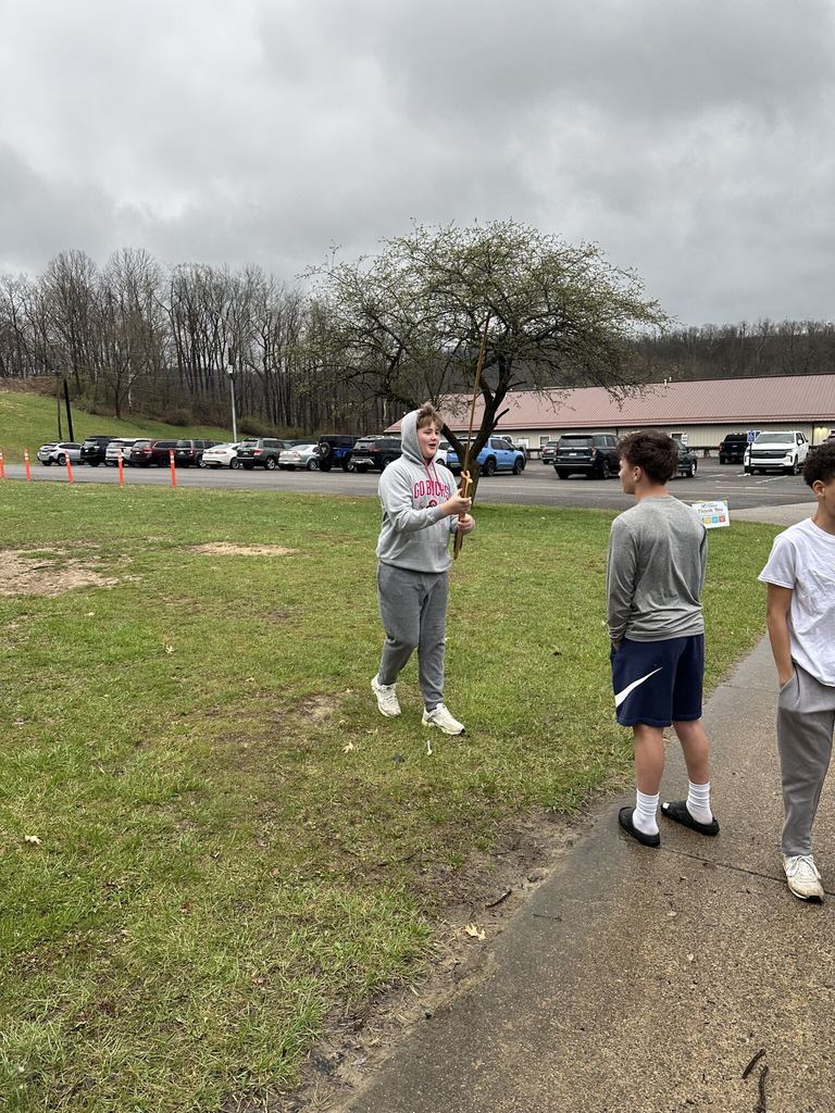 student holding an arrow
