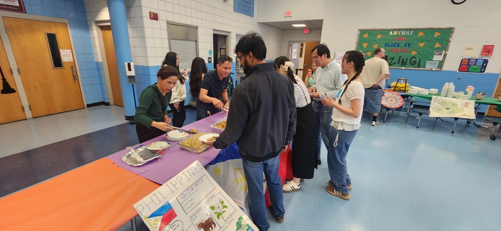 Families sampling Filipino food 