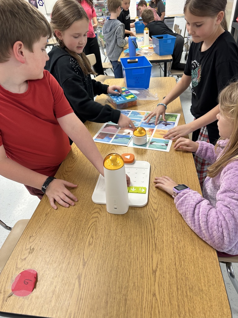 Students programming "robots".
