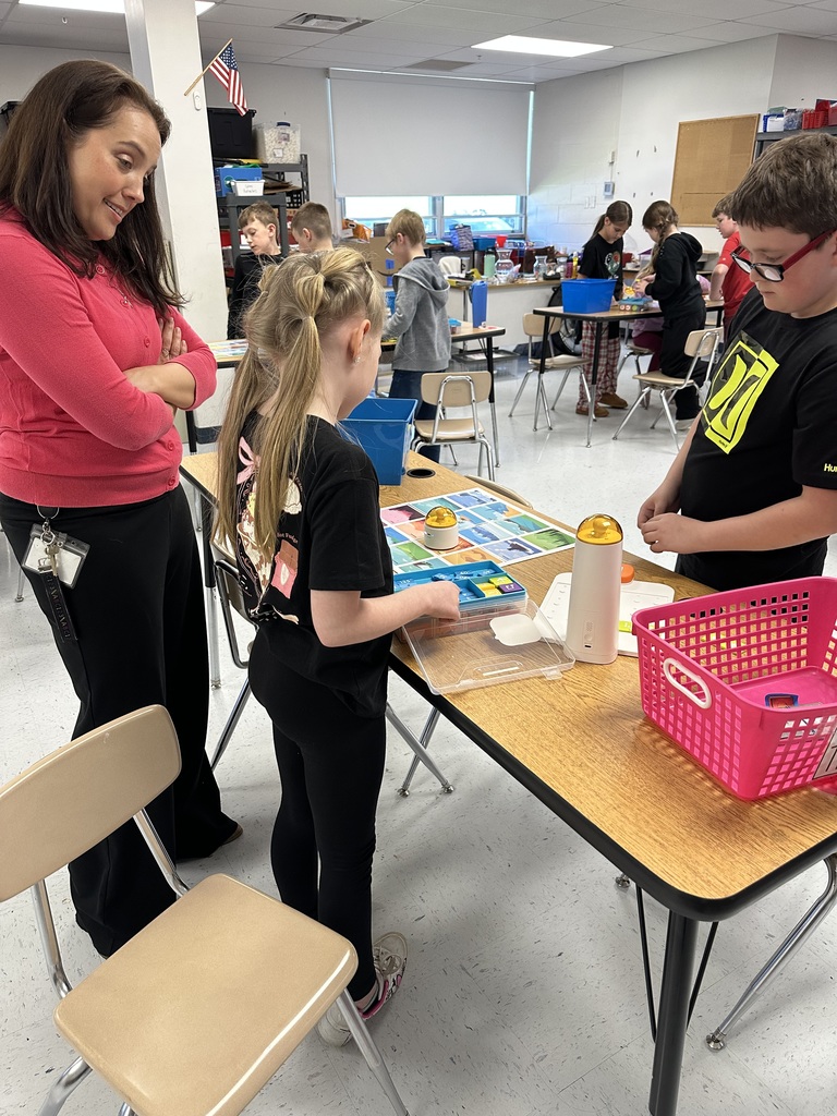 Students programming "robots".