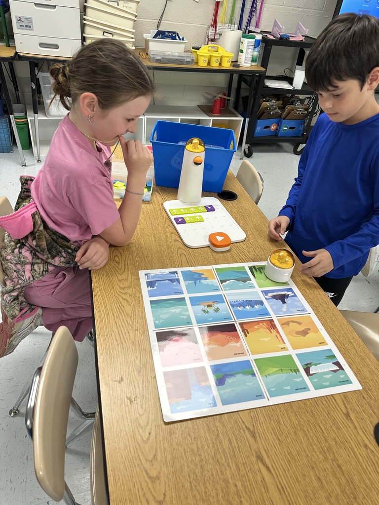 Students programming "robots".