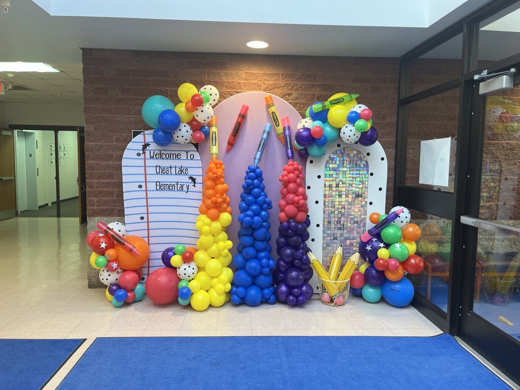 Picture backdrop  with balloons and blow up pencils