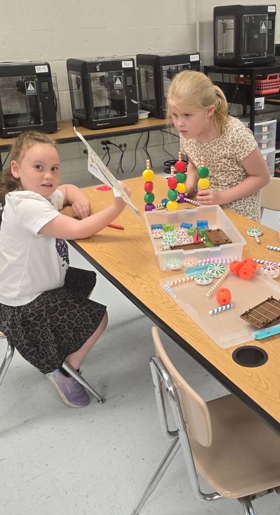 two girls building blocks