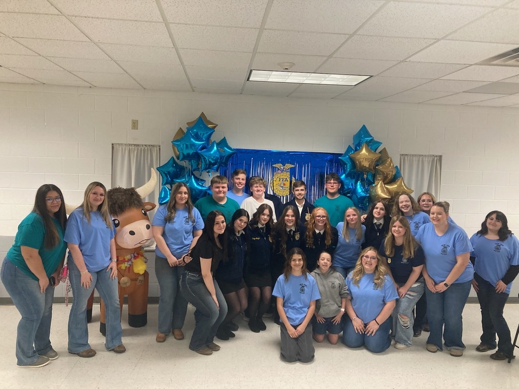 picture of FFA students earing blue tshirts with balloons and streamers celebrating their awards banquet at the Cheat Lak e Volunteer Fire Dept
