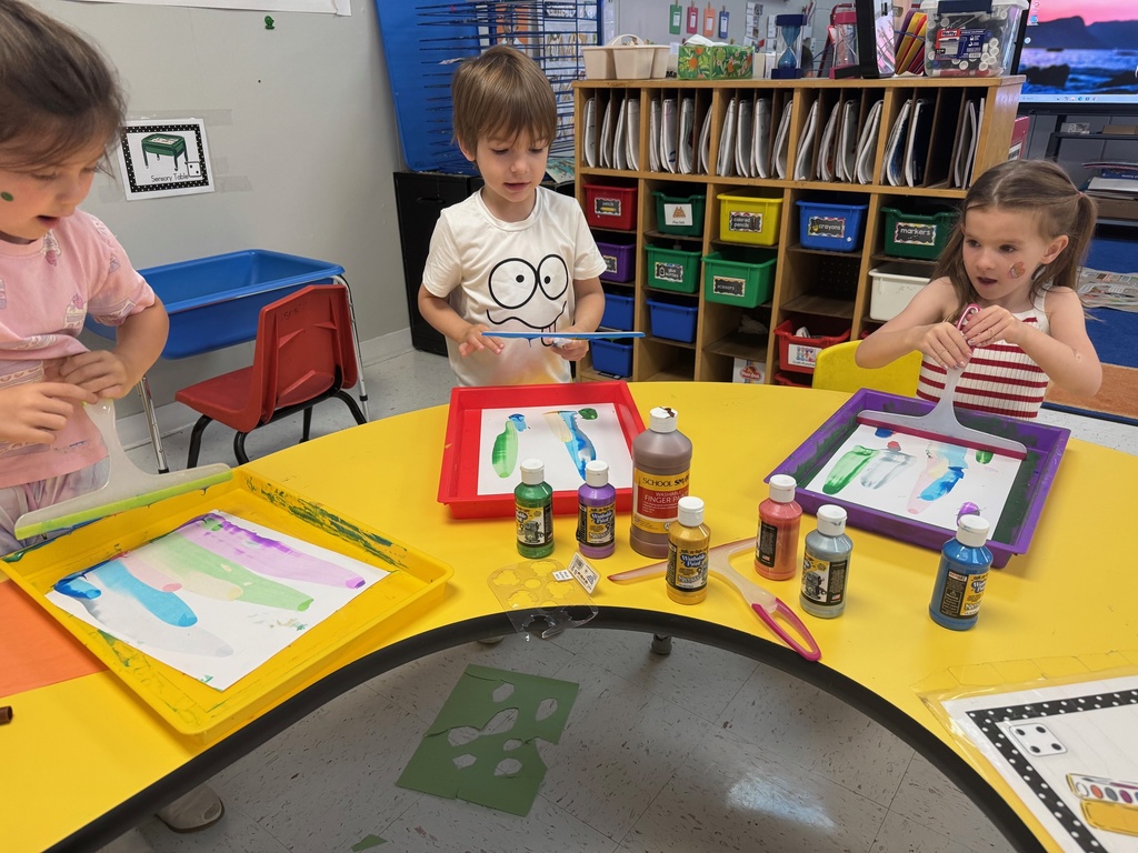 3 students painting