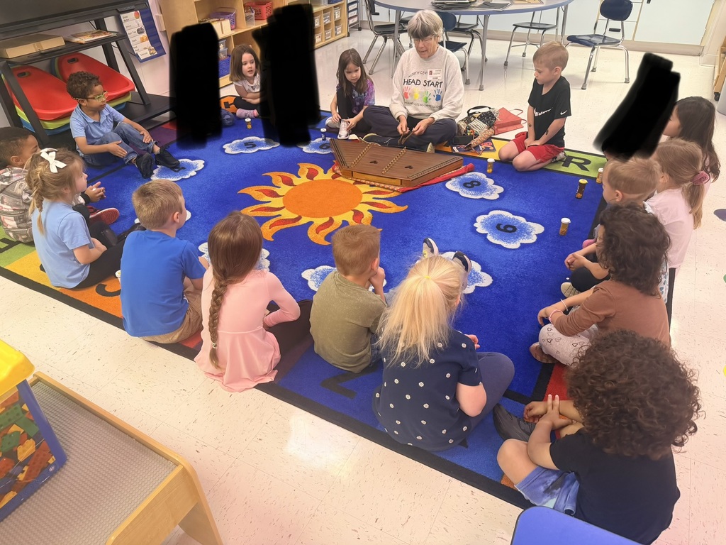 Pre-K students listening to a WV author read aloud. 