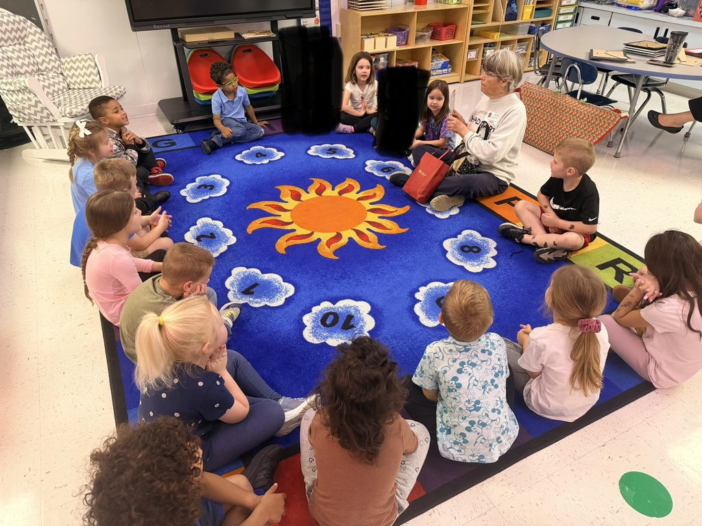 Pre-K students listening to a WV author read aloud. 