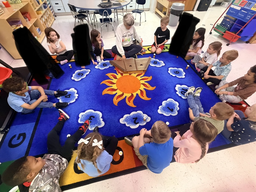 Pre-K students listening to a WV author read aloud. 