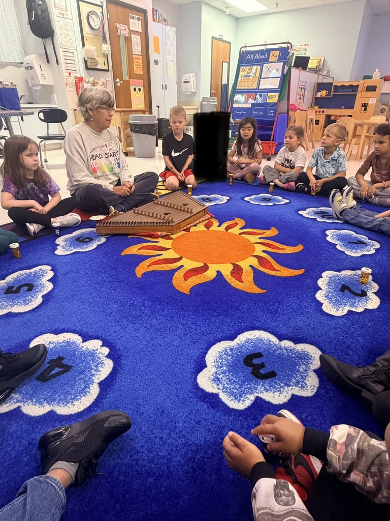 Pre-K students listening to a WV author read aloud. 