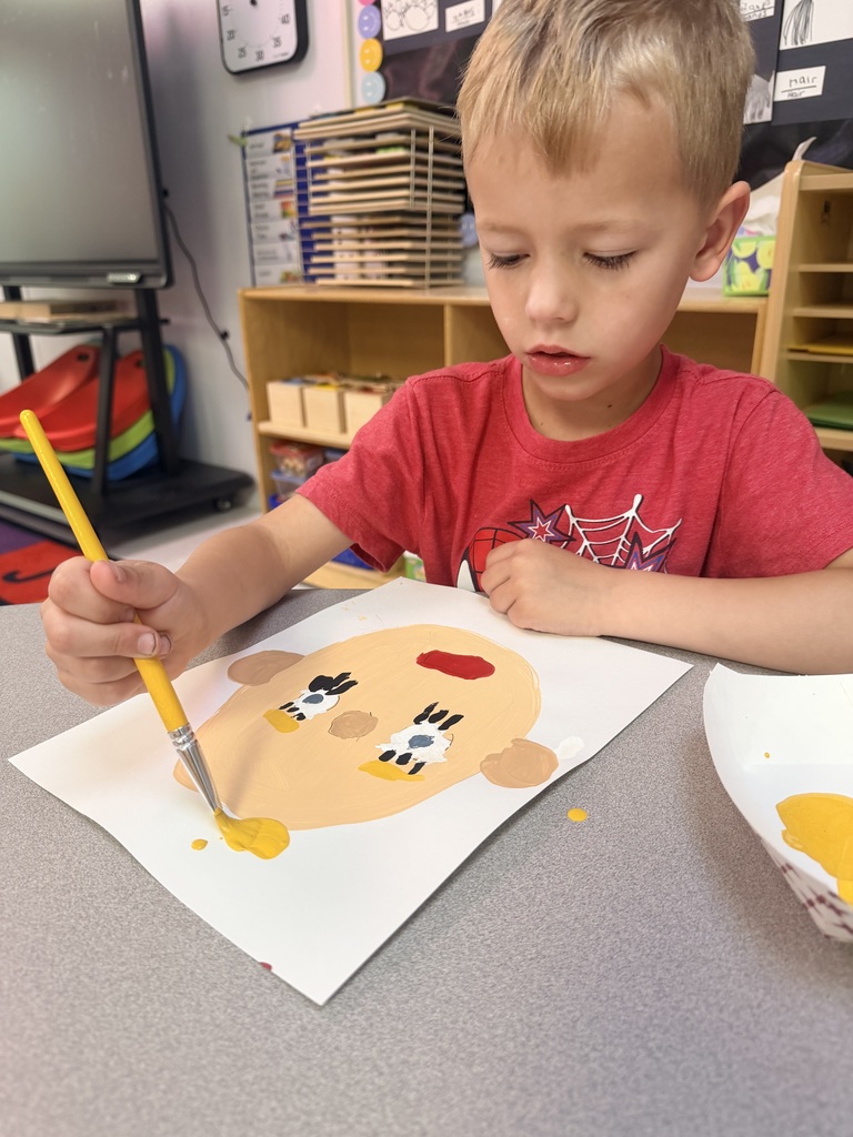 Student painting self portrait