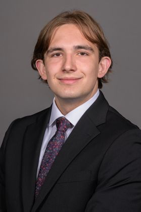 picture of a male student wearing a dark gray suit