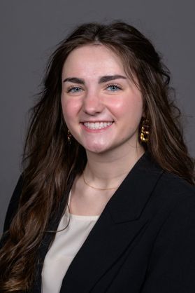 picture of a female student with long hair and a black blazer on