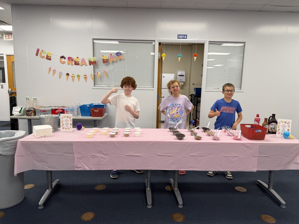 3 students serving ice cream