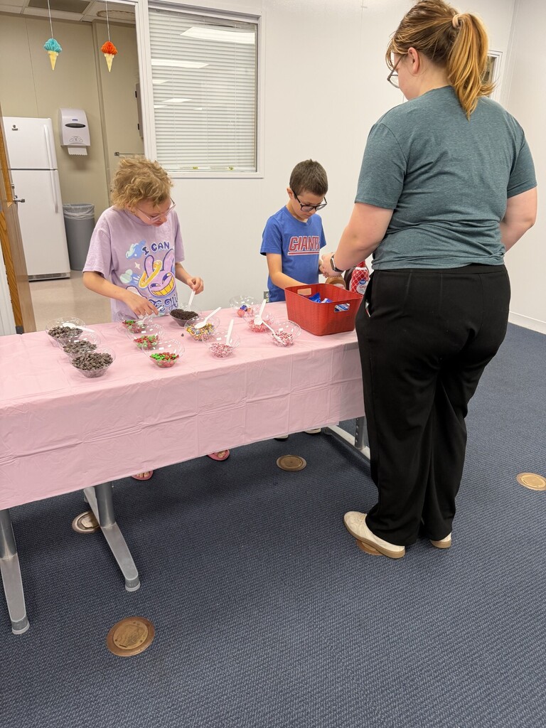 students serving a teacher ice cream