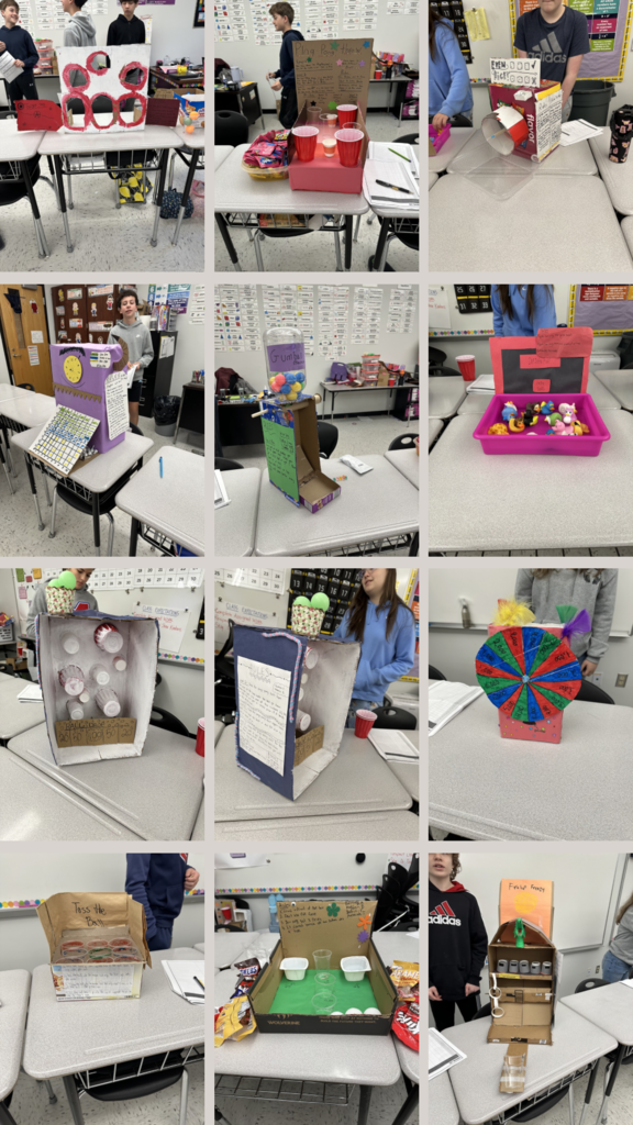 Twelve photos of Probability projects sitting on desks in a classroom.