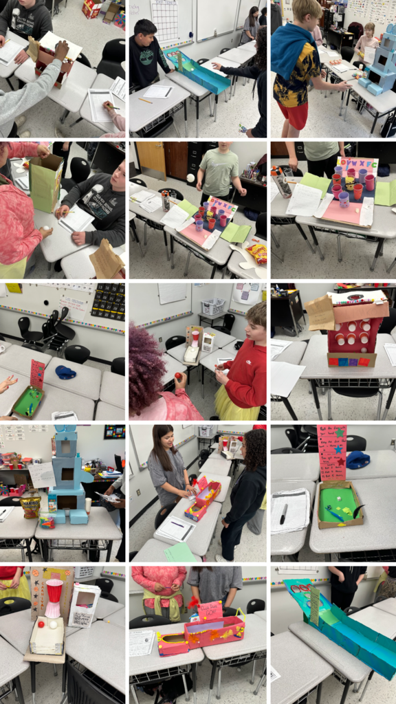 Fifteen photos of Probability projects sitting on desks in a classroom.