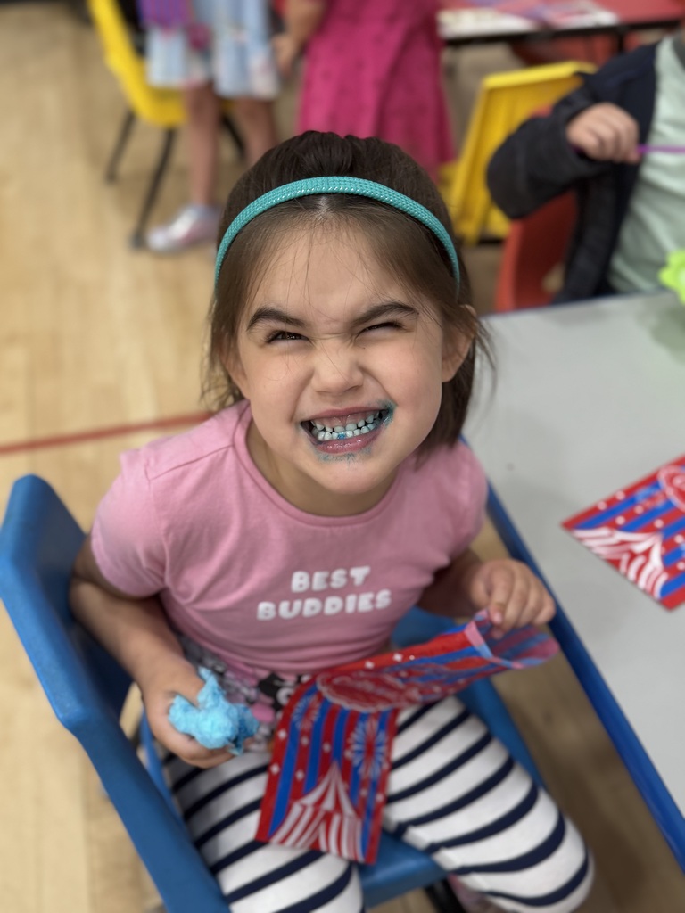 student with a blue mouth due to cotton candy