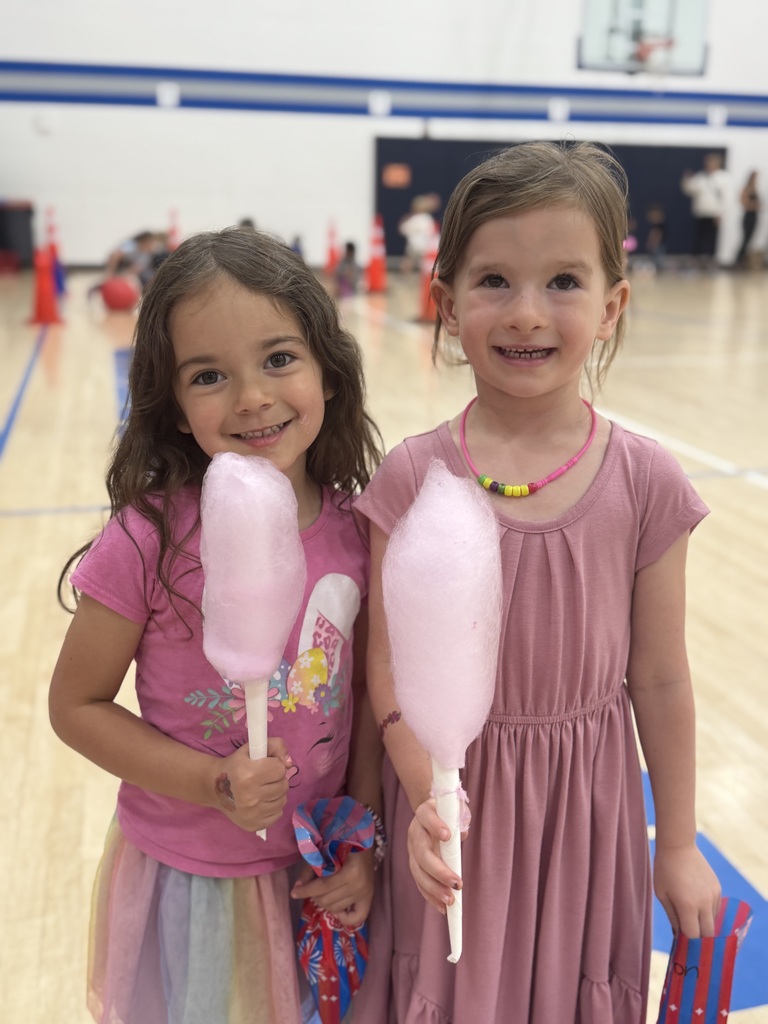 two prek girls eating cotton candy