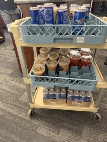 Beige cart with coffees and energy drinks from seven brew.