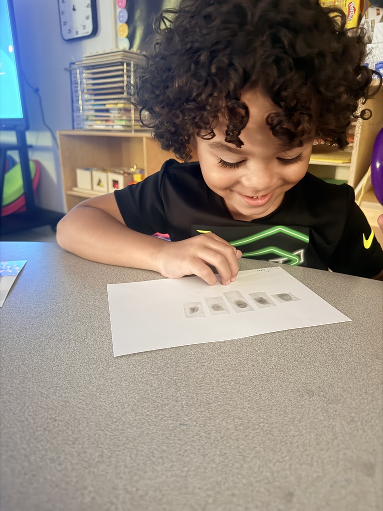 student studying finger prints