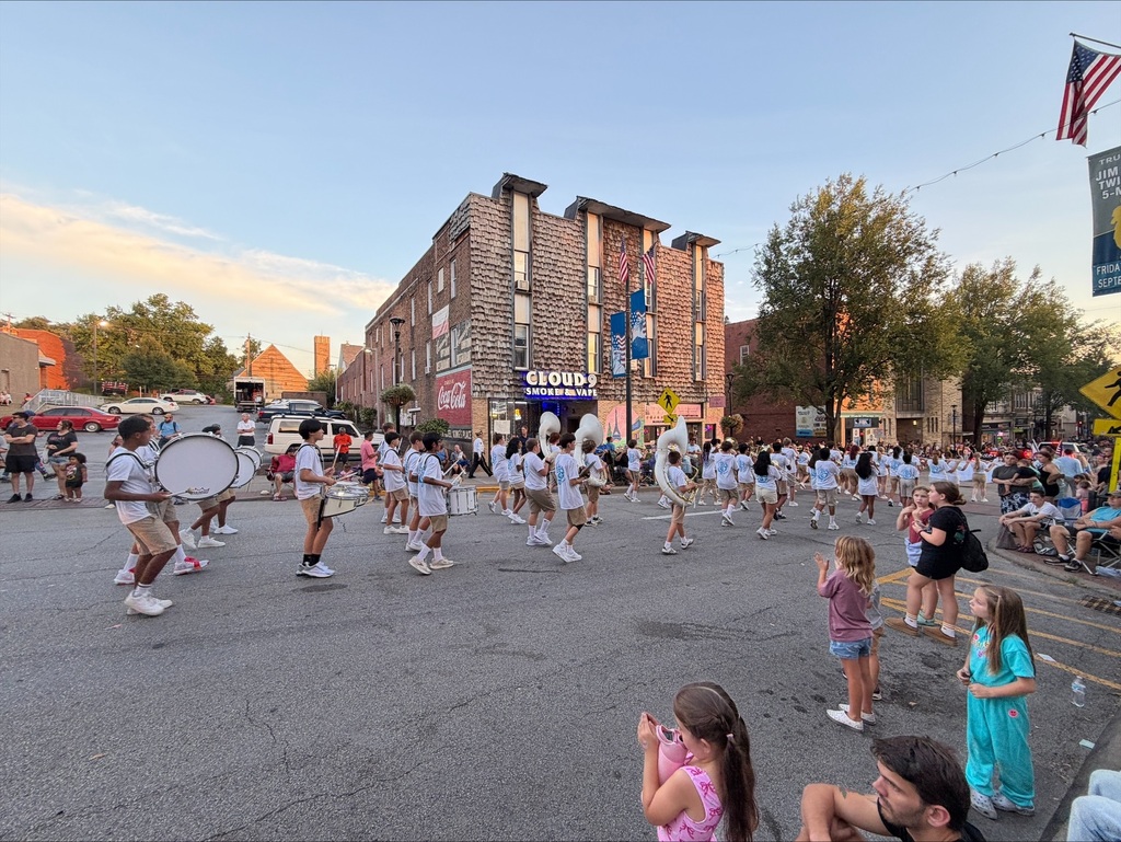 Suncrest Middle School band walking down High Street during the Mon County Fair parade