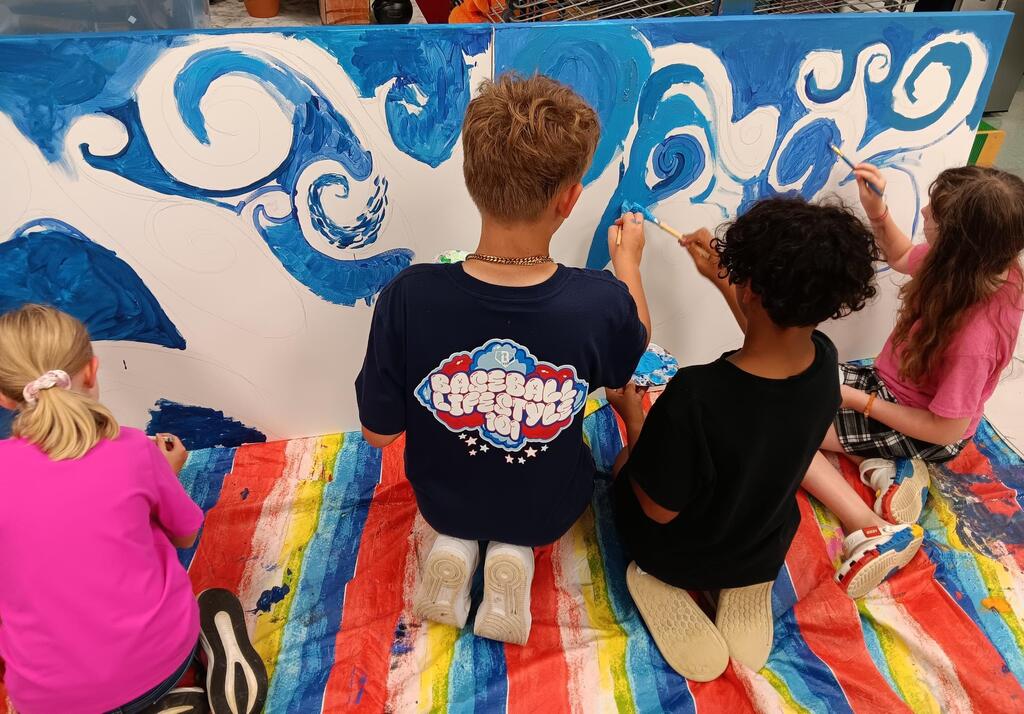 Students painting a mural