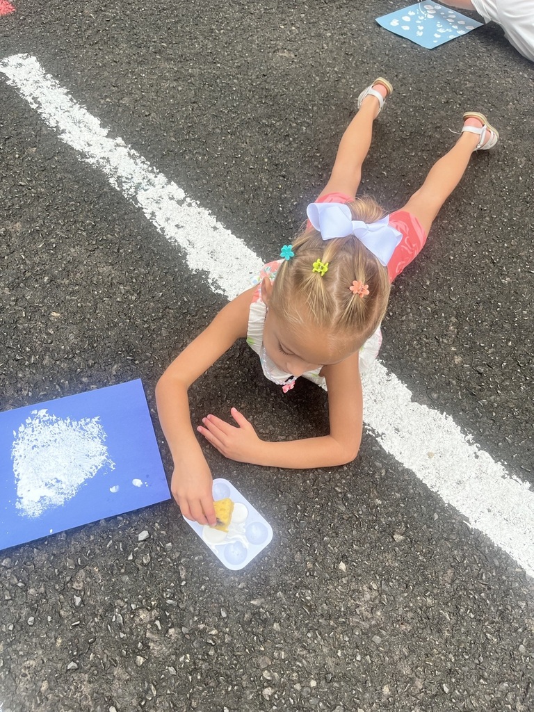 Pre K student with a clipboard